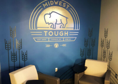 Brand wall that reads "midwest tough" and depicts a buffalo and wheat