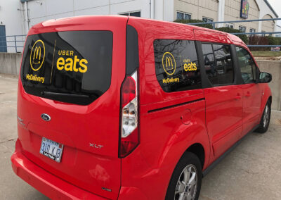 Vinyl window decals on a McDelivery car